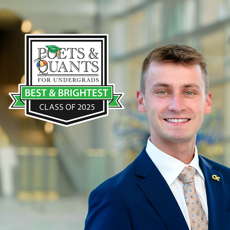 Logan Roach smiles in the Scheller College of Business atrium
