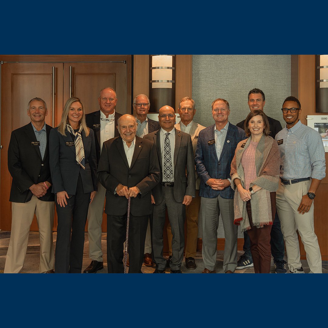 A group photo of the Scheller College of Business Advisory Board, including its new members