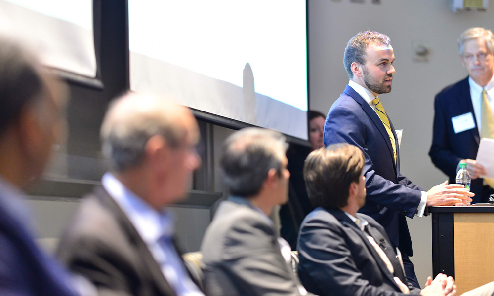 Corey Conklin speaks at an inaugural meeting of the Real Estate Club