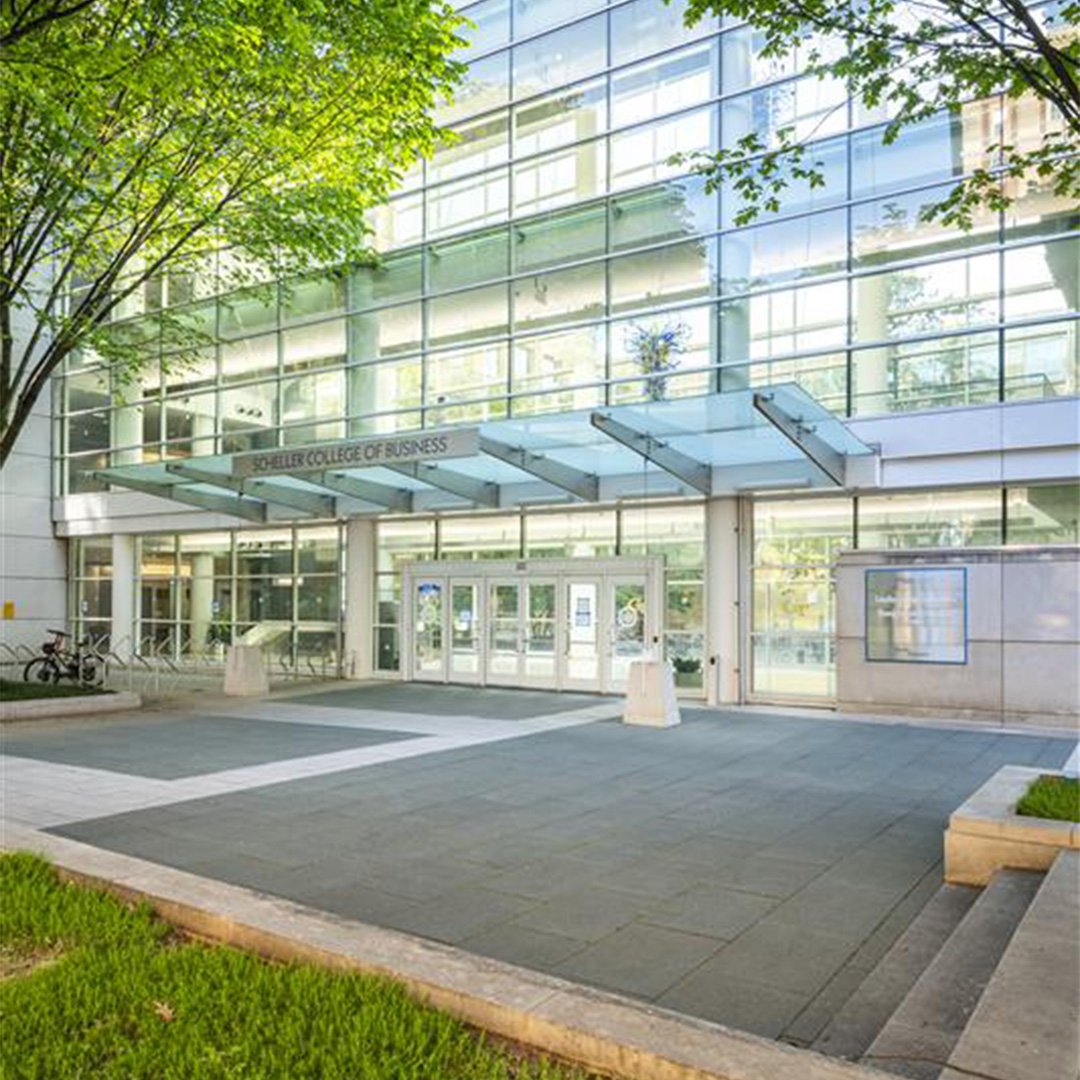 The outside of the Scheller College of Business building in the spring time