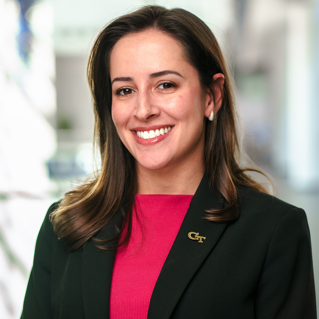 Bruna O’Sullivan, Full-time MBA ‘27 and TI:GER student dressed in a pink blouse and black suit jacket.