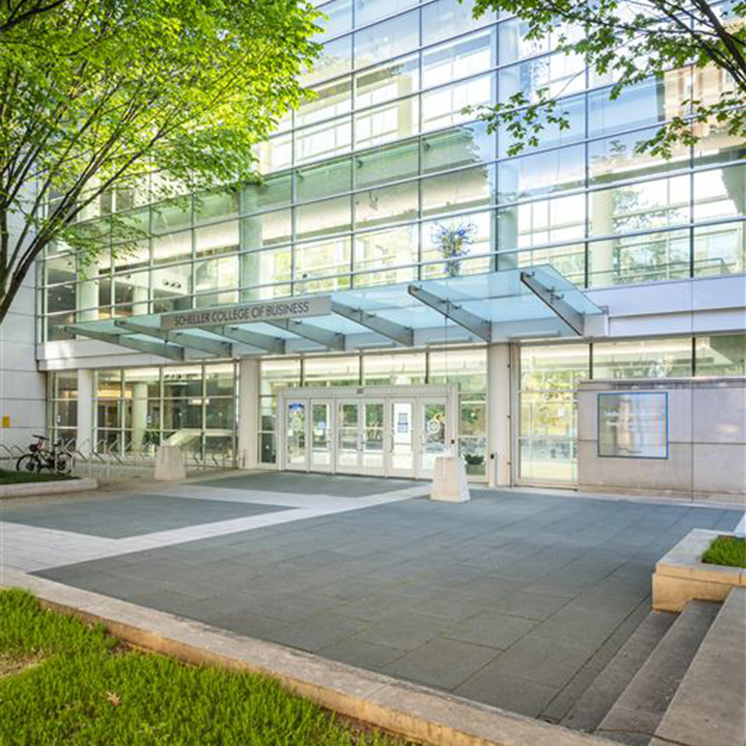 The outside of the Scheller College of Business building in the spring time