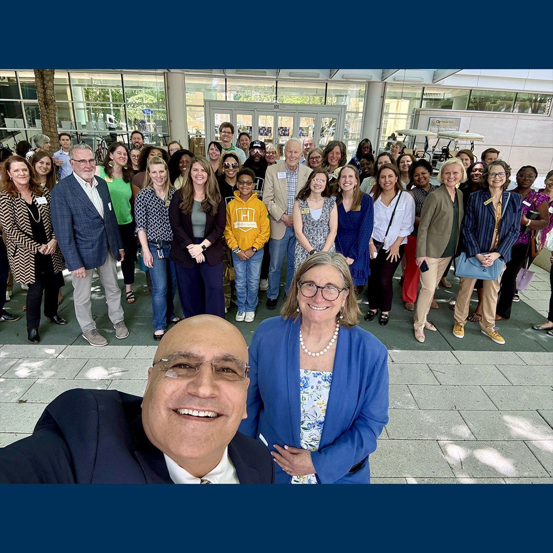 Dean Anuj Mehrotra gathers with stakeholders to celebrate the Institute for Leadership and Social Impact (ILSI) 20-year anniversary.