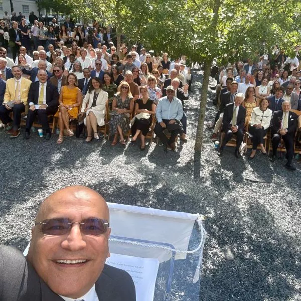 Dean Anuj taking a selfie from the stage at the George Tower|Scheller Tower dedication