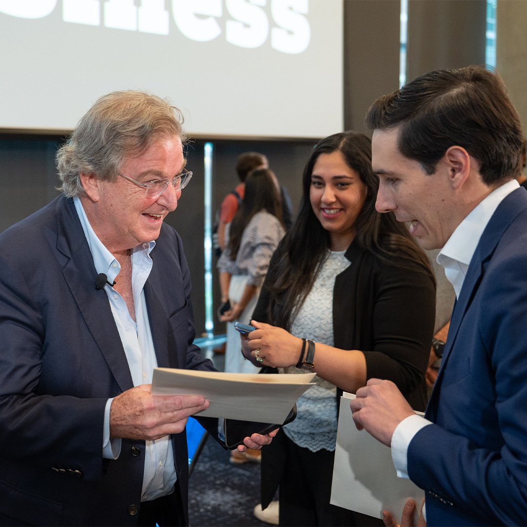 Jaime Gilinski, IE ’78, and CEO of Grupo Nutresa, greets a Georgia Tech student with a smile.