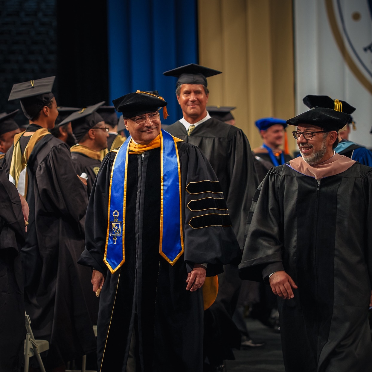 Dean Anuj Mehrotra and the Scheller College platform party participate in the recessional after the Master's graduation ceremony