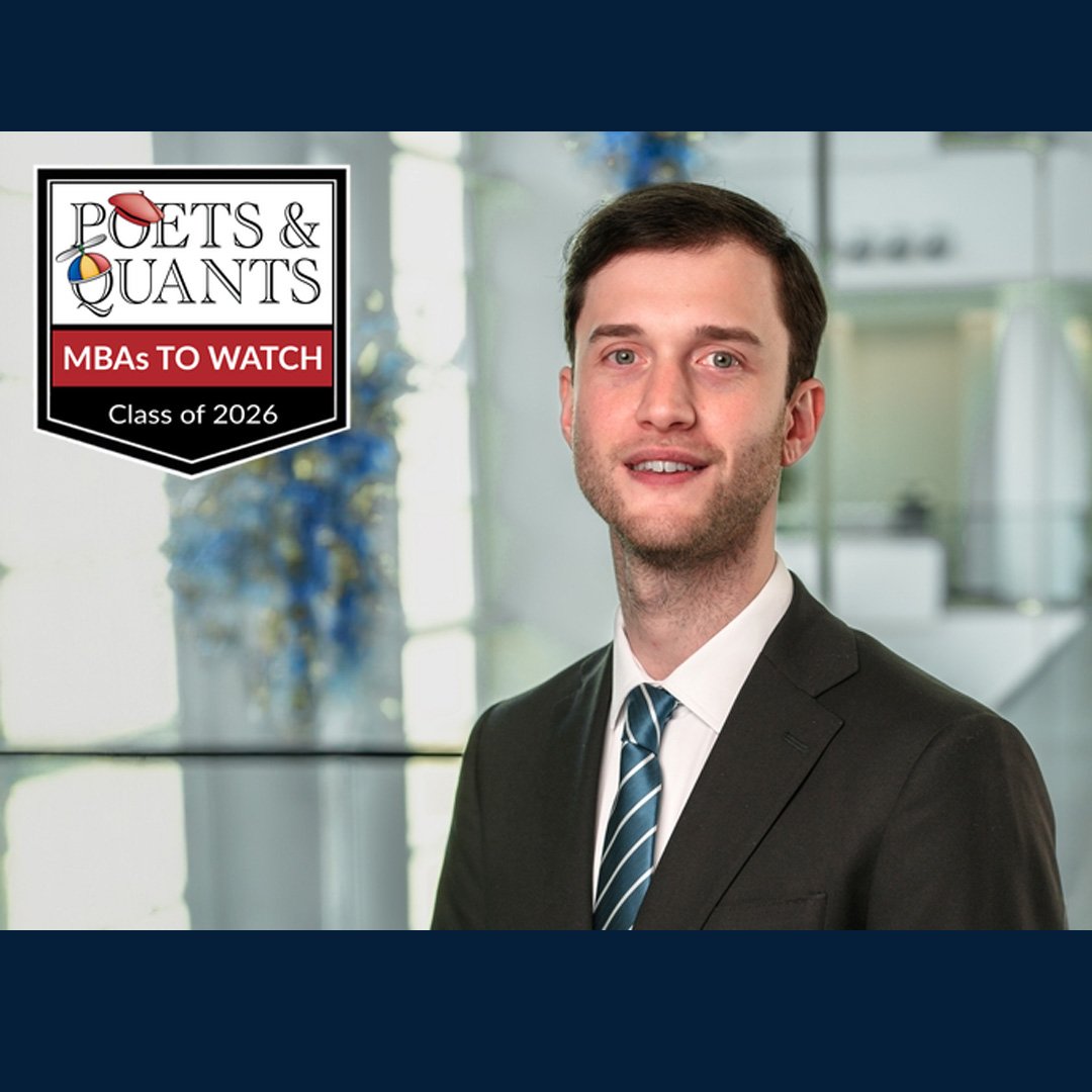 José Antonio Visintini Podio, Full-time MBA '26, smiles in a suit jacket and tie for his Poets&Quants feature.