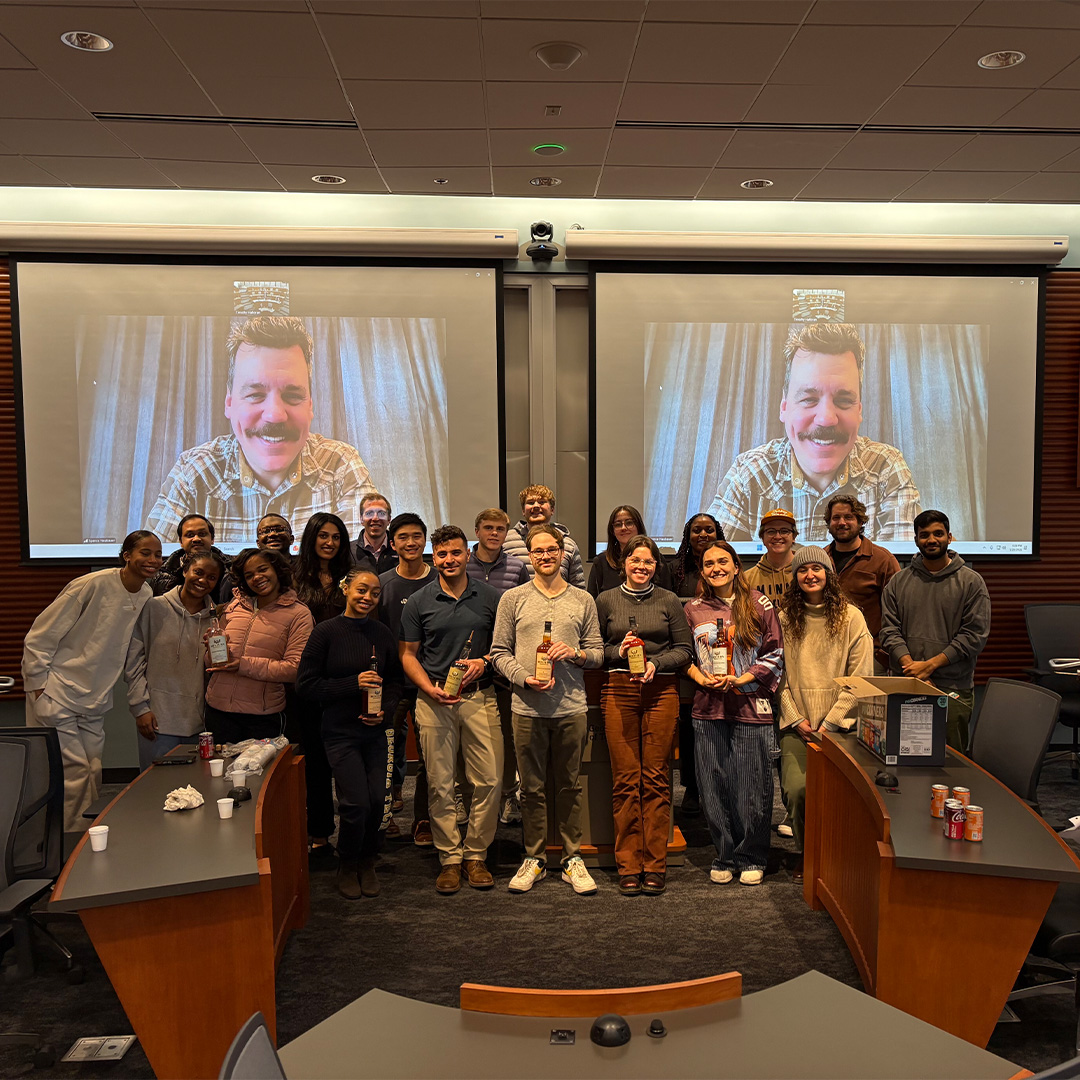 A Scheller marketing class gathers for a whisky tasting as part of their consulting project.