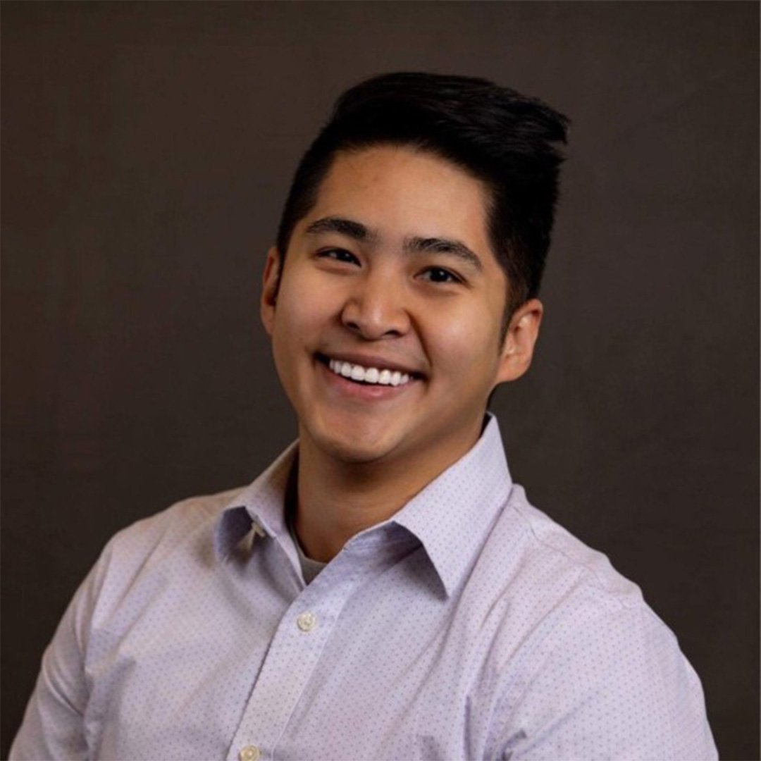 Nam Pham, Evening MBA ’27, smiles in a collared shirt