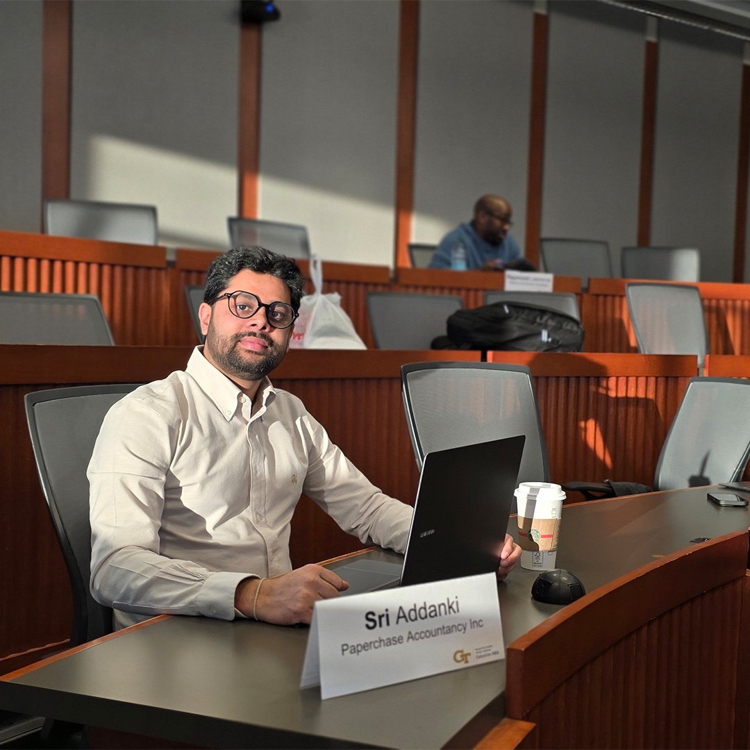 Sri Addanki, Executive MBA ’26, sits in a Scheller classroom.