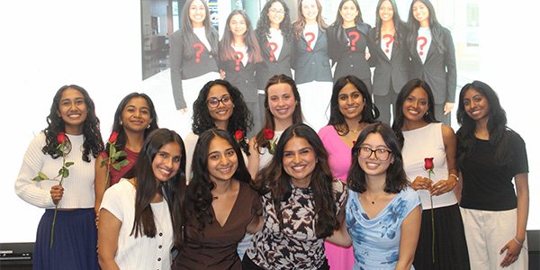 Vedika Singh, front row, second from left, poses with fellow members of the Society of Women in Business.