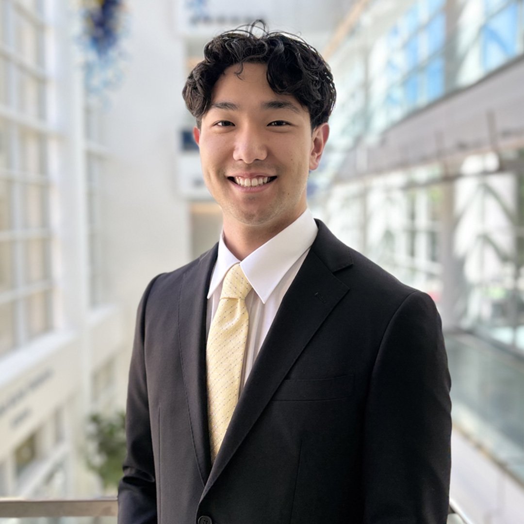 Takuma Matsuki, Scheller B.S. Business Administration ’26, smiles in a suit and tie.