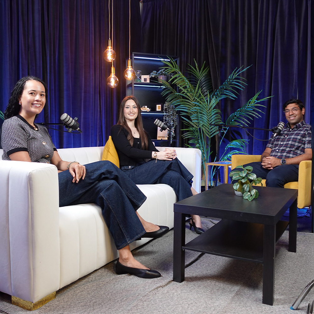 Three MBA students sit down to record a podcast episode.