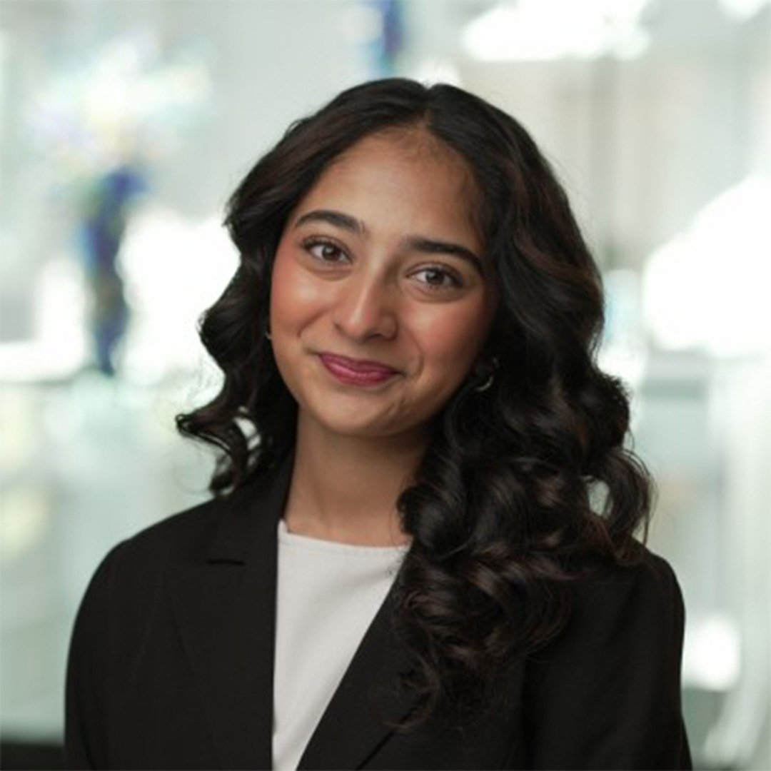 Vedika Singh, BSBA ’28 and Stamps President’s Scholar, smiles in a black suit jacket and white top.