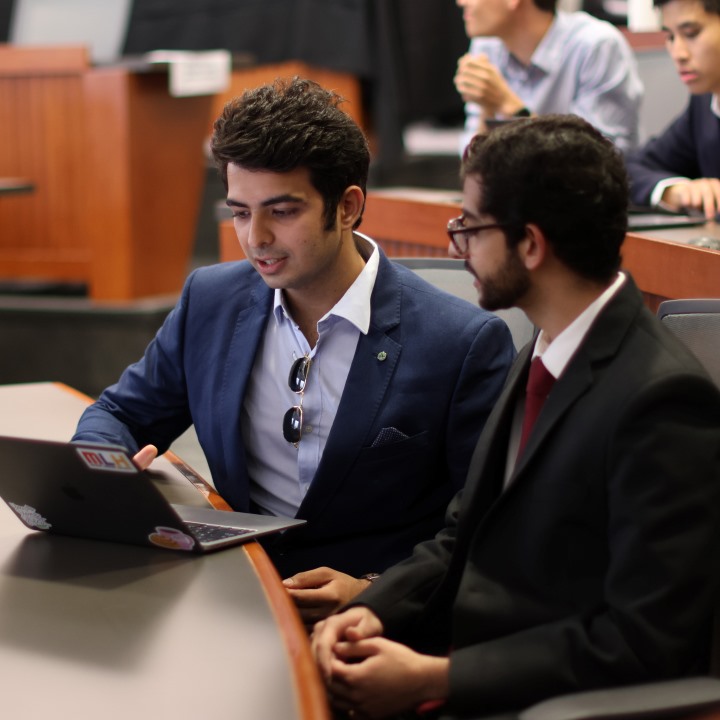 Samaksh Gulati and Saksham Arora make final tweaks to their presentation.