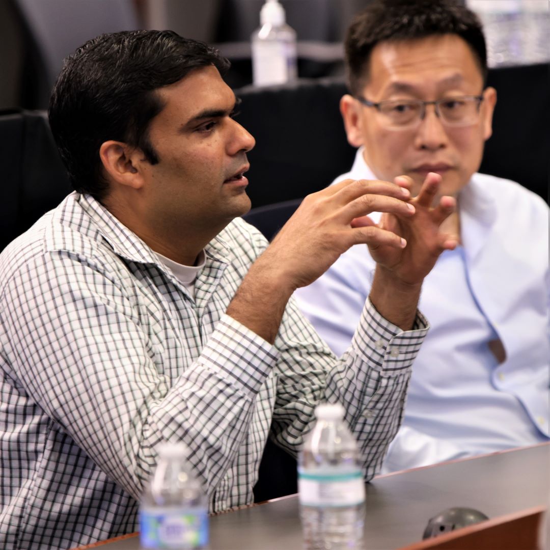 Veritiv team leaders Mihir Jadeja and Gang Wang (not pictured Shashi Chilukuri) commend the students on their computation and presentation.