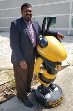 Chuck Easley with Buzz Statue