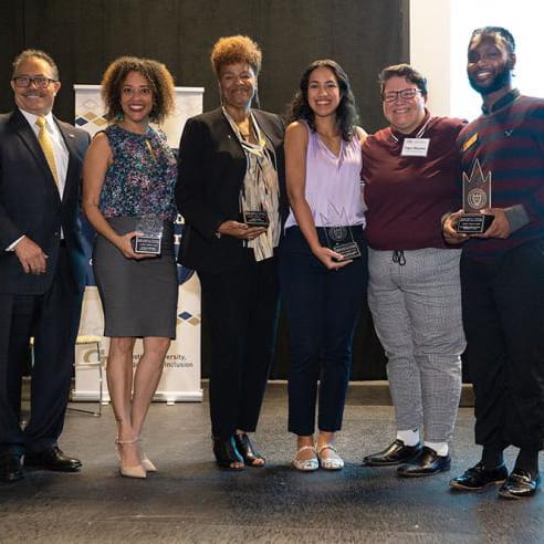 Scheller College staff member Arianna Robinson (second from the left) receives the 2022 Diversity Champion Award 2022