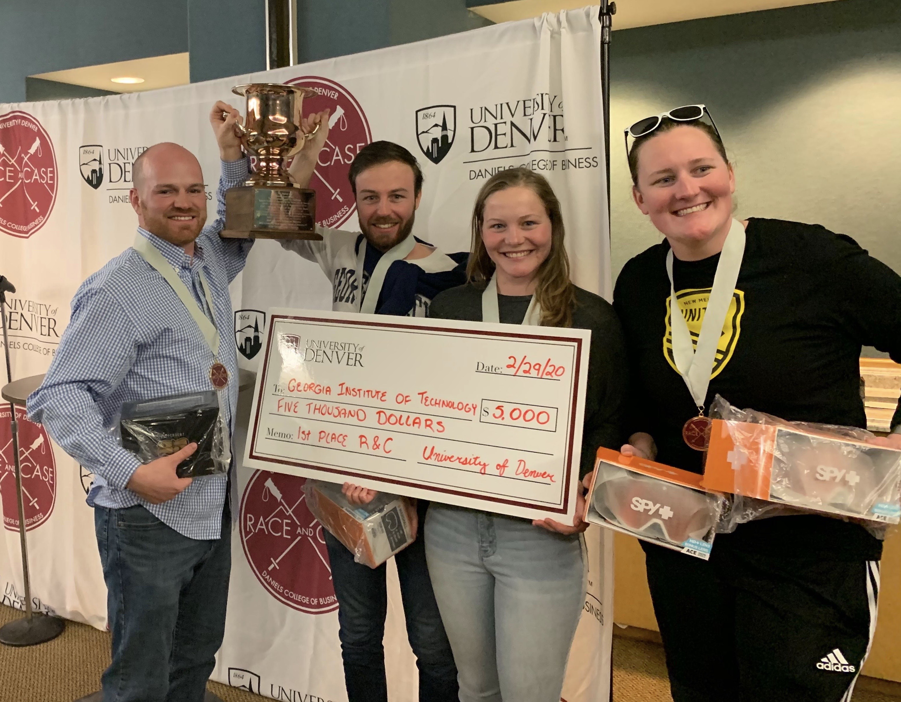 (L-R) Henry McGill, Yann de Luca, Clotilde Bignard, and Anna Smoak receive first prize at the Race and Case competition.