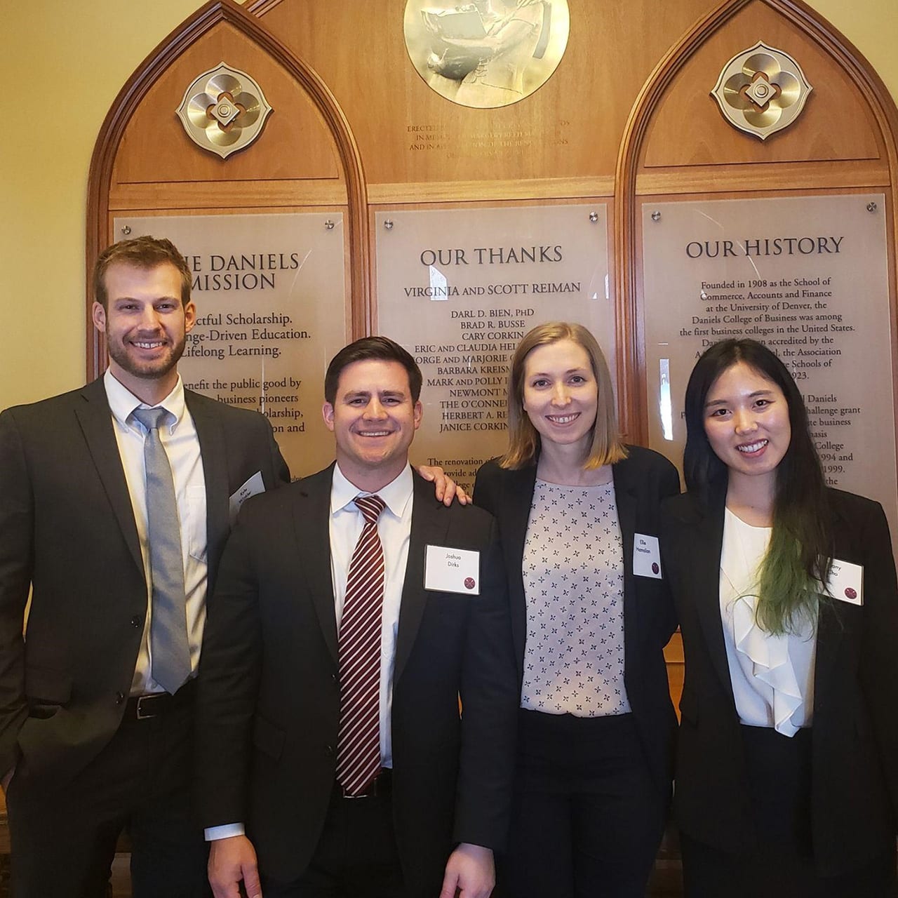 Kyle Winkler, Josh Dirks, Ellie Hamalian, and Tiffany Cho, following their business case presentation at the University of Denver Daniels College of Business