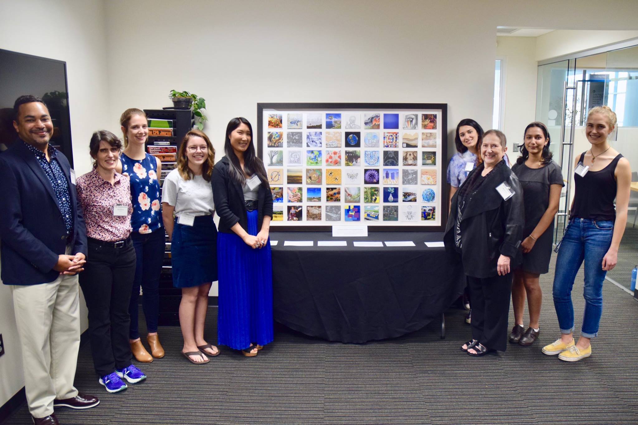 Artists pose with their final artwork