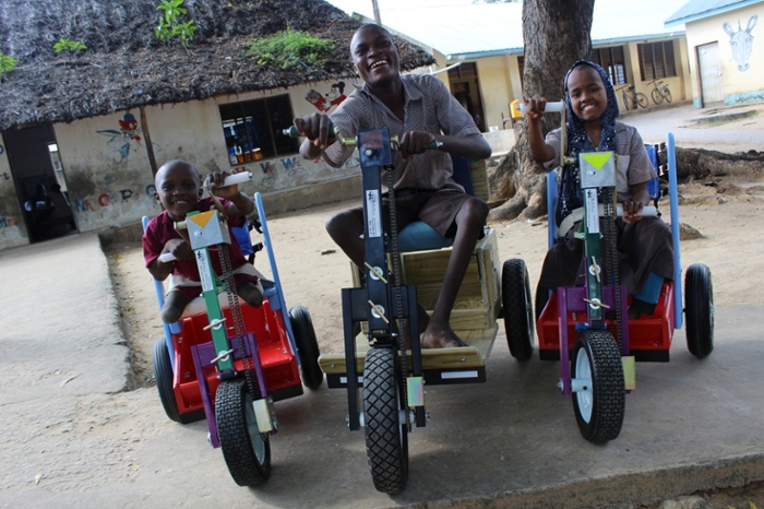 Patients in Kenya receive Mobility Carts donated by MedShare. Photo Credit: MedShare.