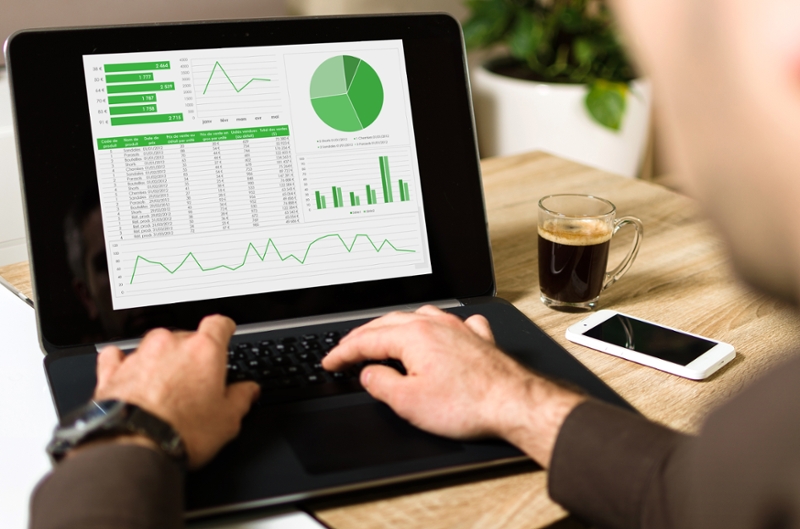 How do announcements of environmentally friendly initiatives affect the shareholder value of publicly traded companies?