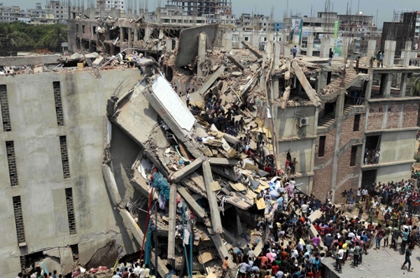 Rescuers work at the collapsed Rana Plaza building in Dhaka in 2013. Photograph: ZUMA/REX